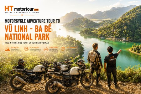 two men standing on a cliff overlooking a body of water Vu linh motorbikes tour